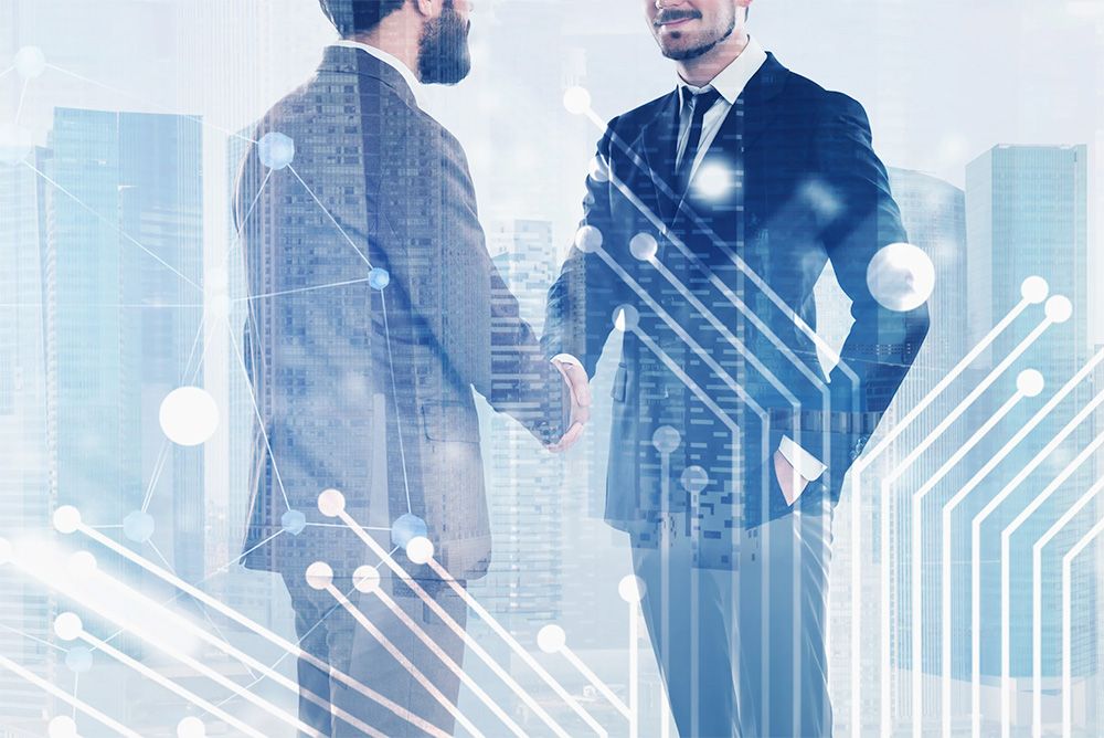 2-business-men-shaking-hands-improving-network.jpg