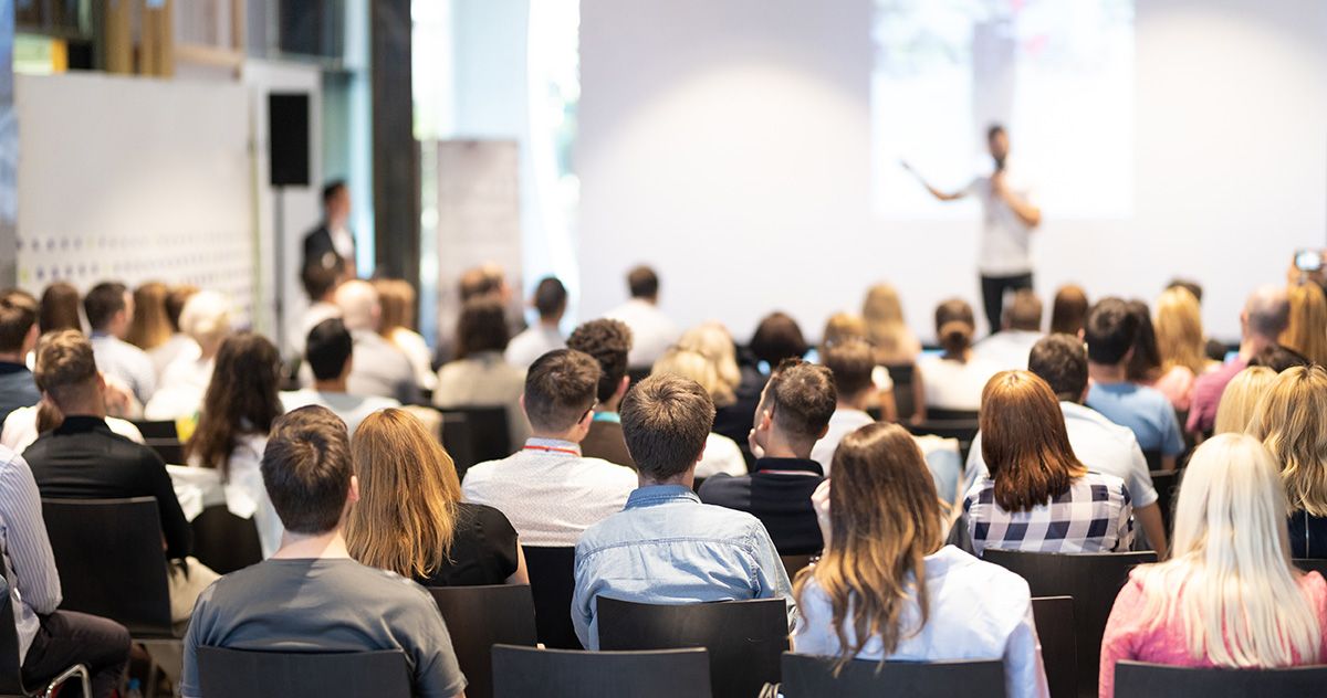 Crowd attending a business conference.